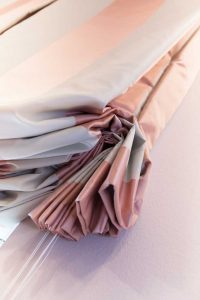 detail of pink strip curtains